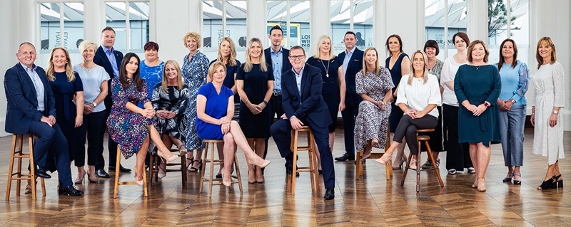 Photo of Atom Metro Credit Union team celebrating.